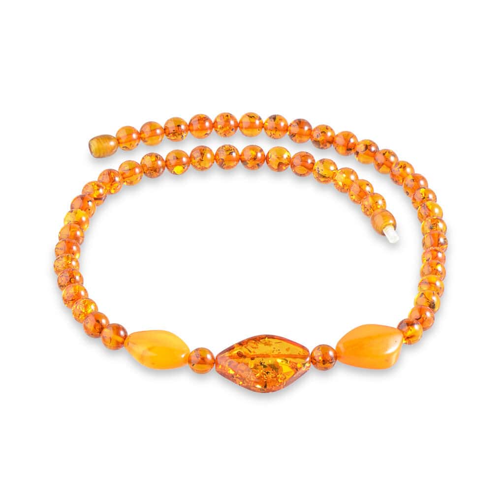 Vibrant amber necklace with marquise centerpiece and round beads in warm orange tones
