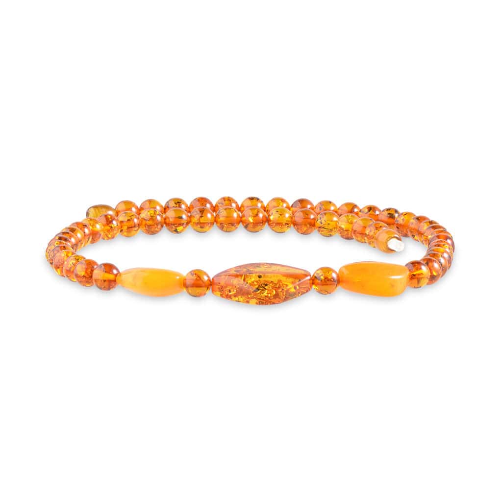 Amber beaded bracelet with warm honey and orange tones, featuring smooth and elongated amber accents.