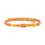Amber beaded bracelet with warm honey and orange tones, featuring smooth and elongated amber accents.
