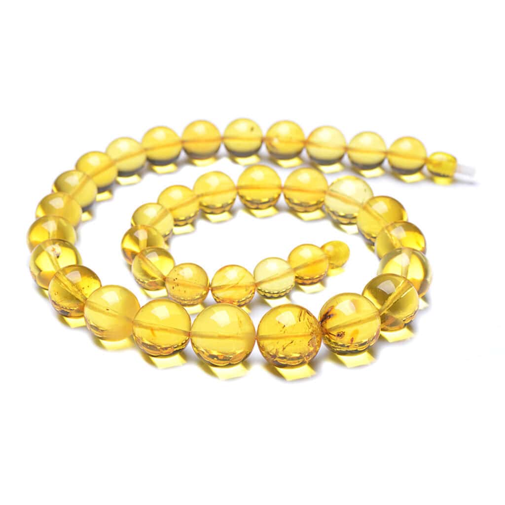 Handmade Baltic amber necklace with warm, golden-yellow, translucent beads and artisan craftsmanship.