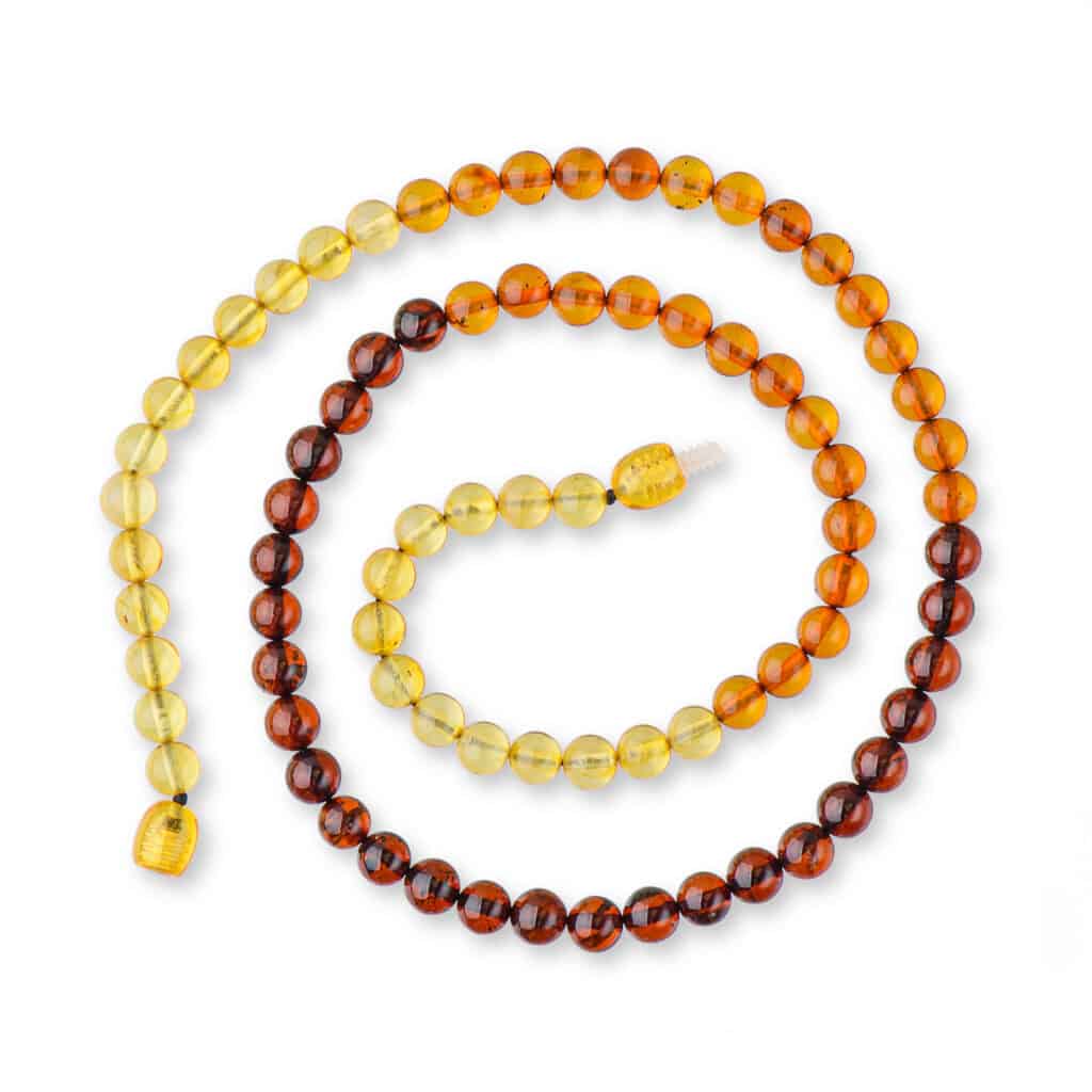 Handmade Baltic amber mala with warm gradient beads, ideal for meditation and stylish accessories.