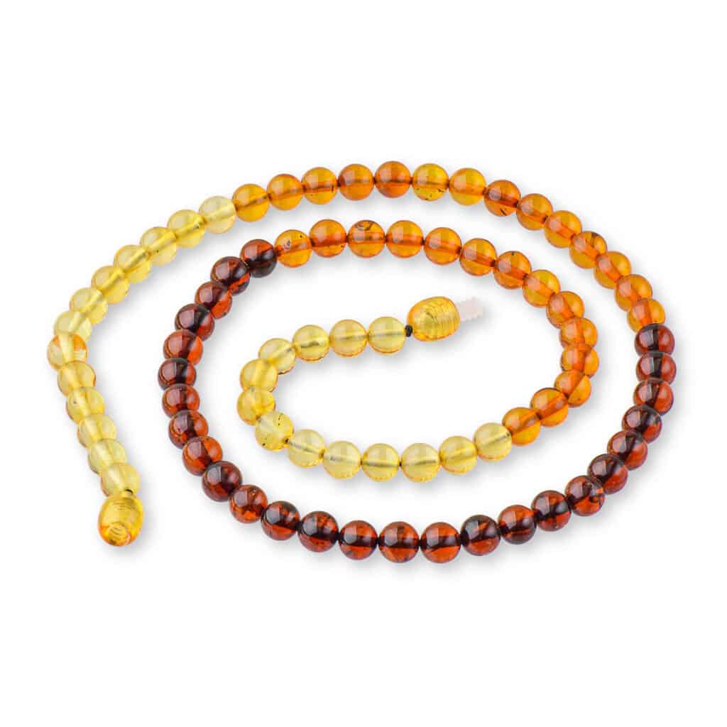 Handmade Baltic amber necklace with gradient yellow to orange-brown beads, elegant and natural.