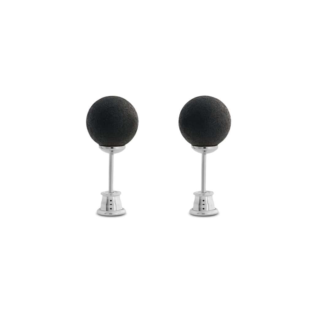 Pair of modern black spherical microphones on adjustable metal stands for studio or broadcast use.