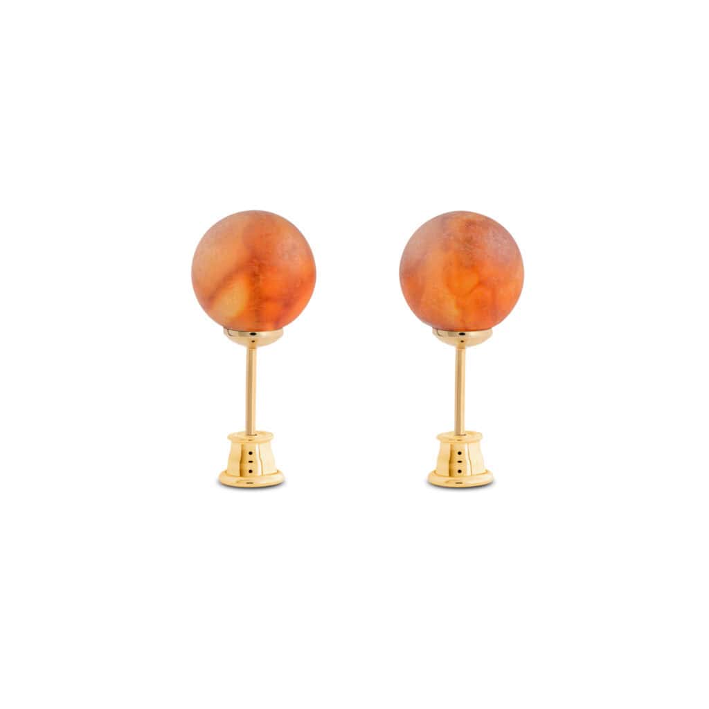 Elegant amber earrings with gold accents and warm orange spherical gemstones for versatile style.