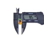 Digital caliper measuring an object with an 8.5-unit display reading.