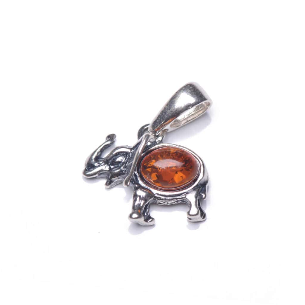 Sterling silver elephant pendant with warm amber gemstone, handcrafted and uniquely stylish.
