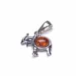 Sterling silver elephant pendant with warm amber gemstone, handcrafted and uniquely stylish.