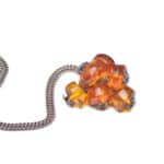 Colorful amber beaded pendant necklace with silver chain, handcrafted artistic jewelry for stylish wear.