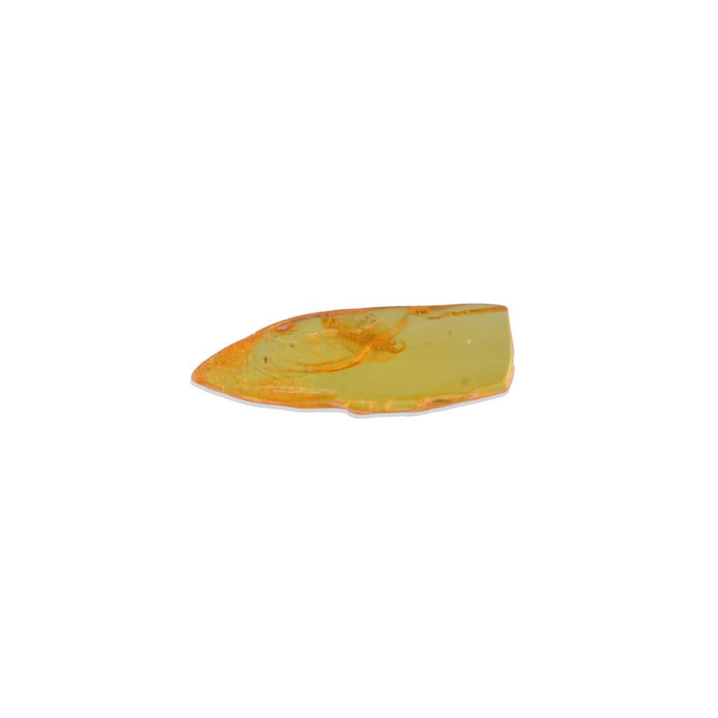 Bright yellow gemstone fragment with sharp edges and natural orange streaks, ideal for jewelry or collections.