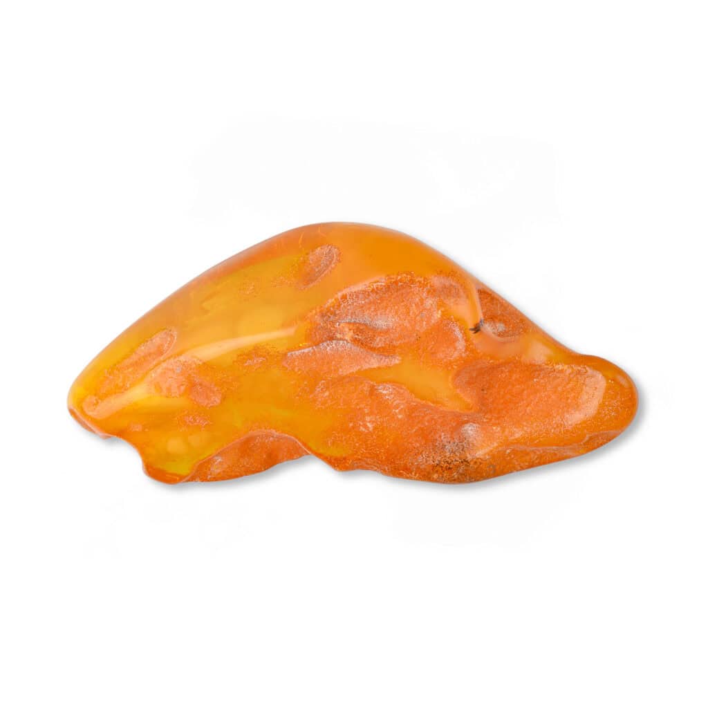 Close-up of warm Baltic amber with natural inclusions and organic patterns showcasing age and beauty.