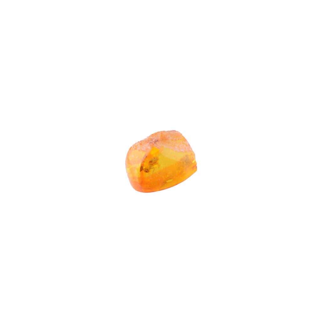Small polished amber piece with warm glow and natural inclusions, showcasing Baltic craftsmanship.