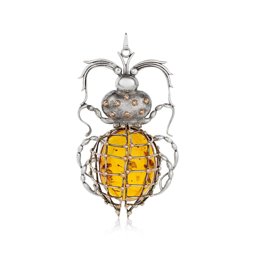 Elegant insect-shaped Baltic amber pendant with intricate silver wirework and gemstone accents.