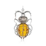 Elegant insect-shaped Baltic amber pendant with intricate silver wirework and gemstone accents.