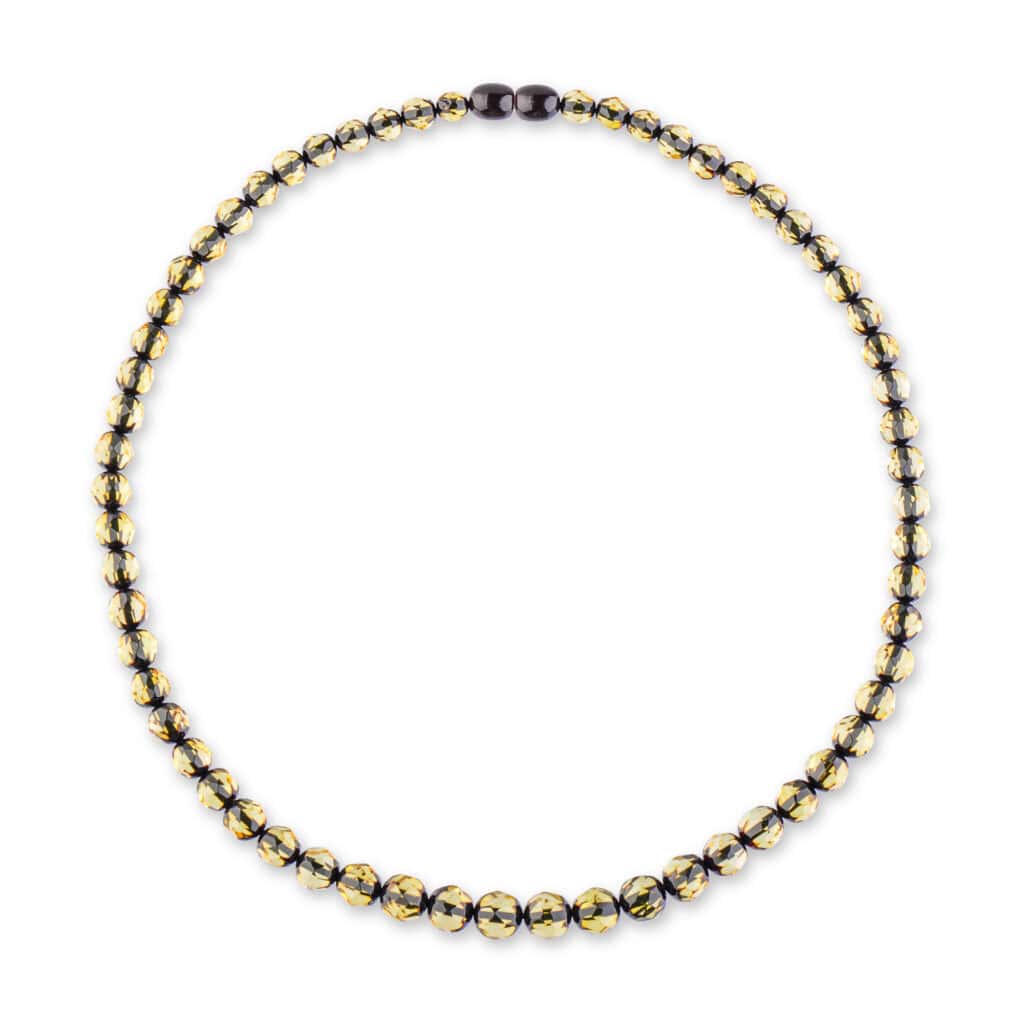 Handcrafted Baltic amber necklace with golden and dark beads for versatile elegance.