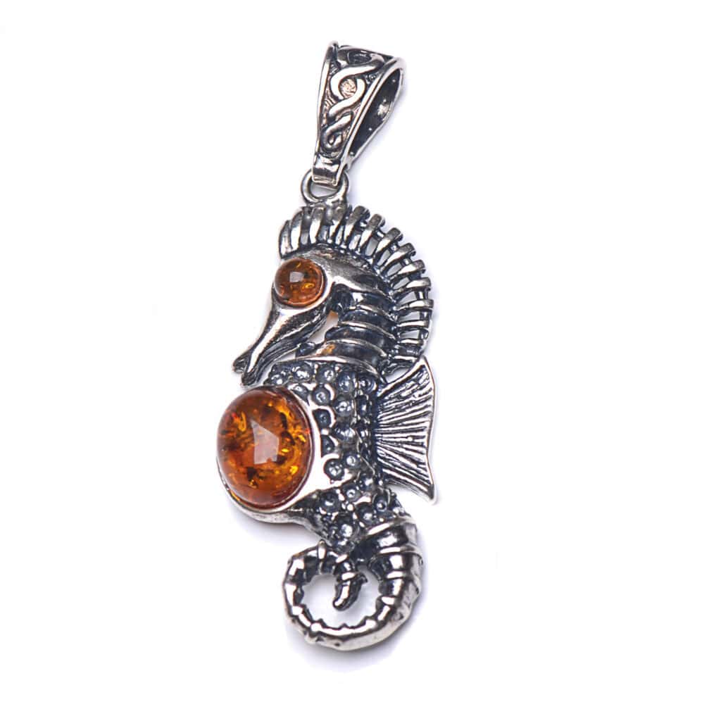 Silver seahorse pendant with amber accents, handcrafted jewelry, ocean-inspired, elegant gift, versatile accessory.