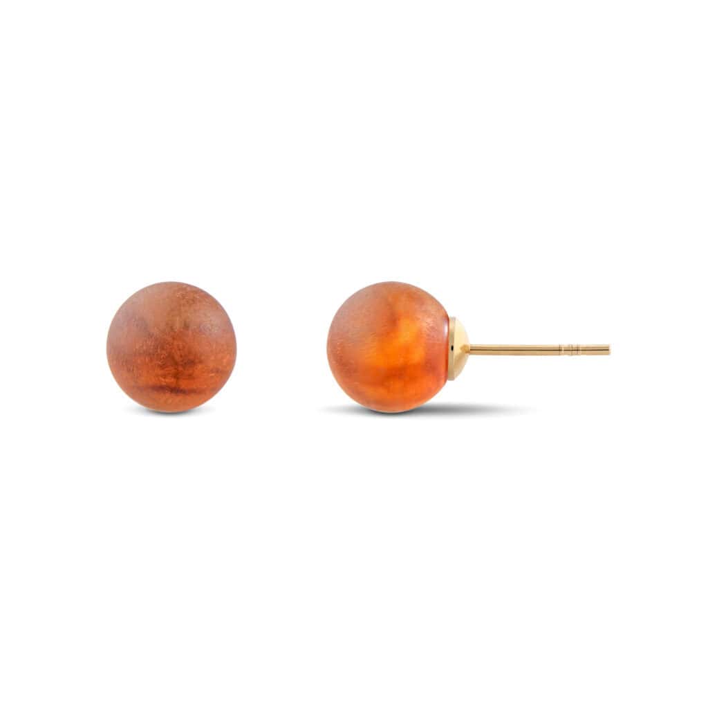 Elegant amber spherical earrings with gold studs, perfect for everyday or special occasions.