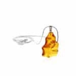 Handmade Baltic amber star pendant on silver chain, featuring warm, natural cognac hues and unique inclusions.