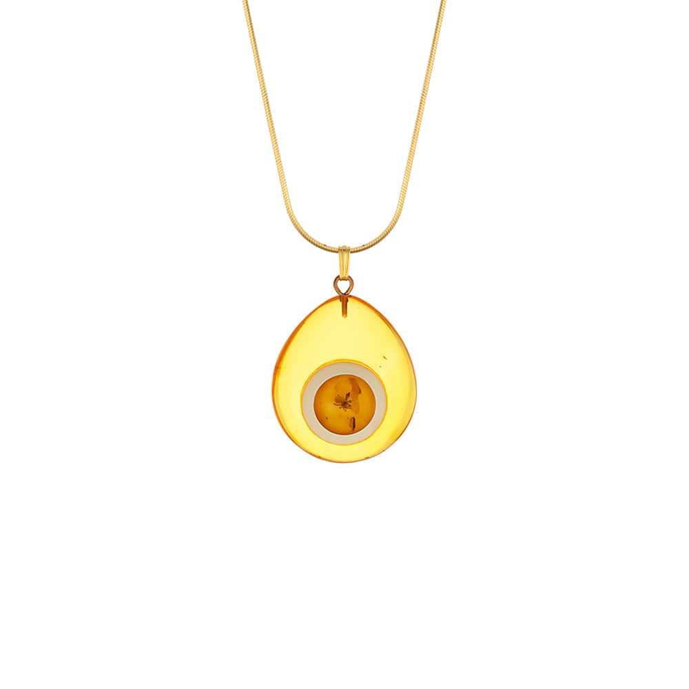 Golden teardrop amber pendant necklace on delicate gold chain, elegant and artisanal jewelry accessory.