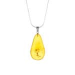 Beautiful amber teardrop pendant with natural inclusions on a silver chain.
