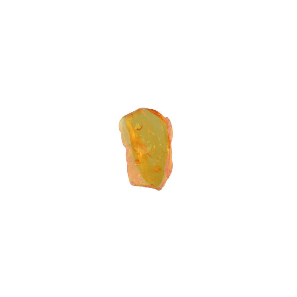 Small polished yellow-orange mineral with natural grooves, reflecting light on a white background.