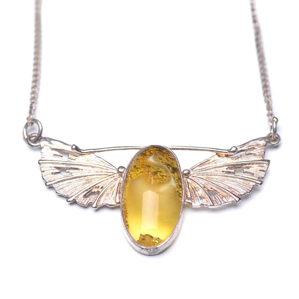 Baltic amber necklace with silver butterfly wings, elegant and natural jewelry for any occasion.