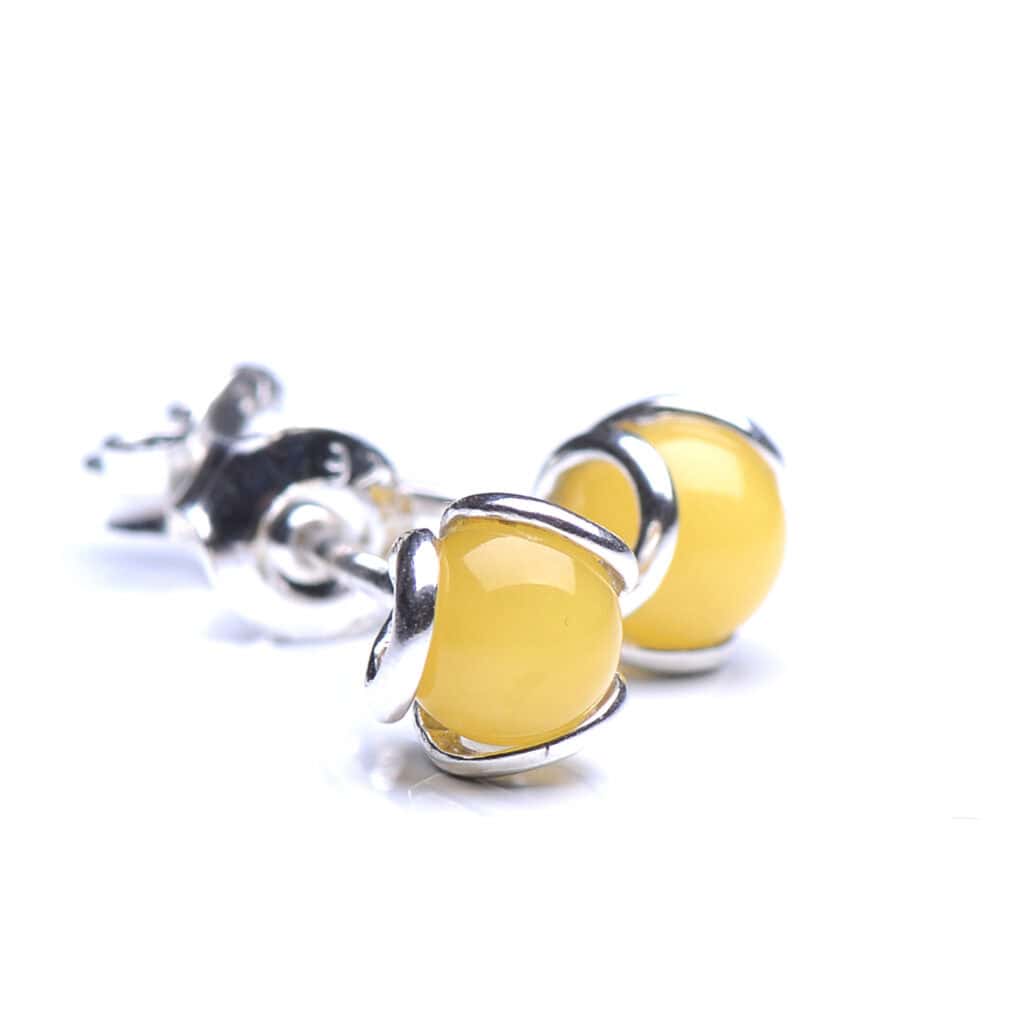 Cheerful yellow gemstone earrings with silver clasps, perfect for everyday or elegant occasions.