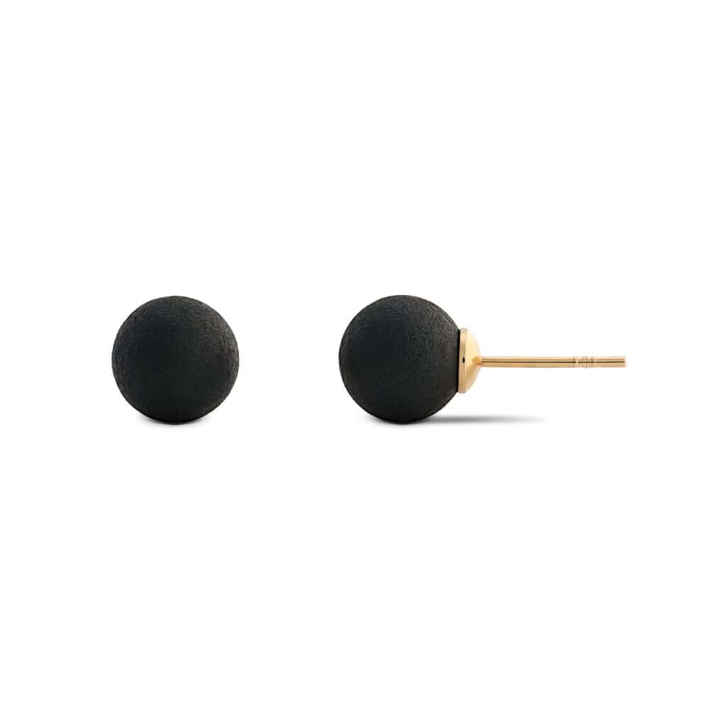 Minimalist black spherical earrings with gold-toned posts, perfect for modern, versatile jewelry styles.