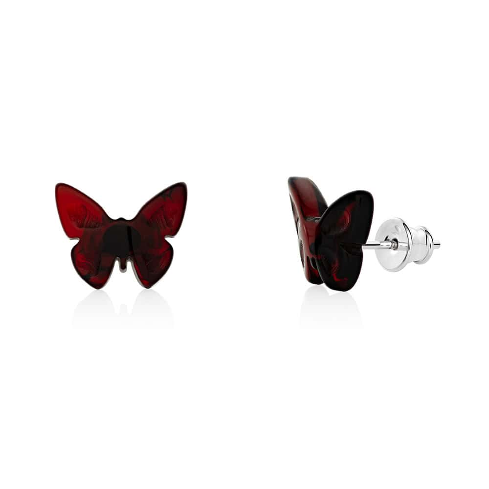 Red butterfly-shaped stud earrings with silver posts, elegant and handcrafted for versatile style.