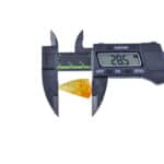 Digital caliper measures a yellow cone’s diameter at 28.5mm with high precision.