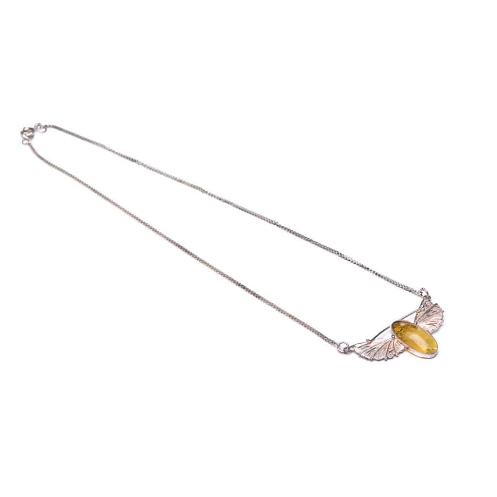 Yellow gemstone necklace with delicate silver wing design and sleek chain, perfect for any occasion.