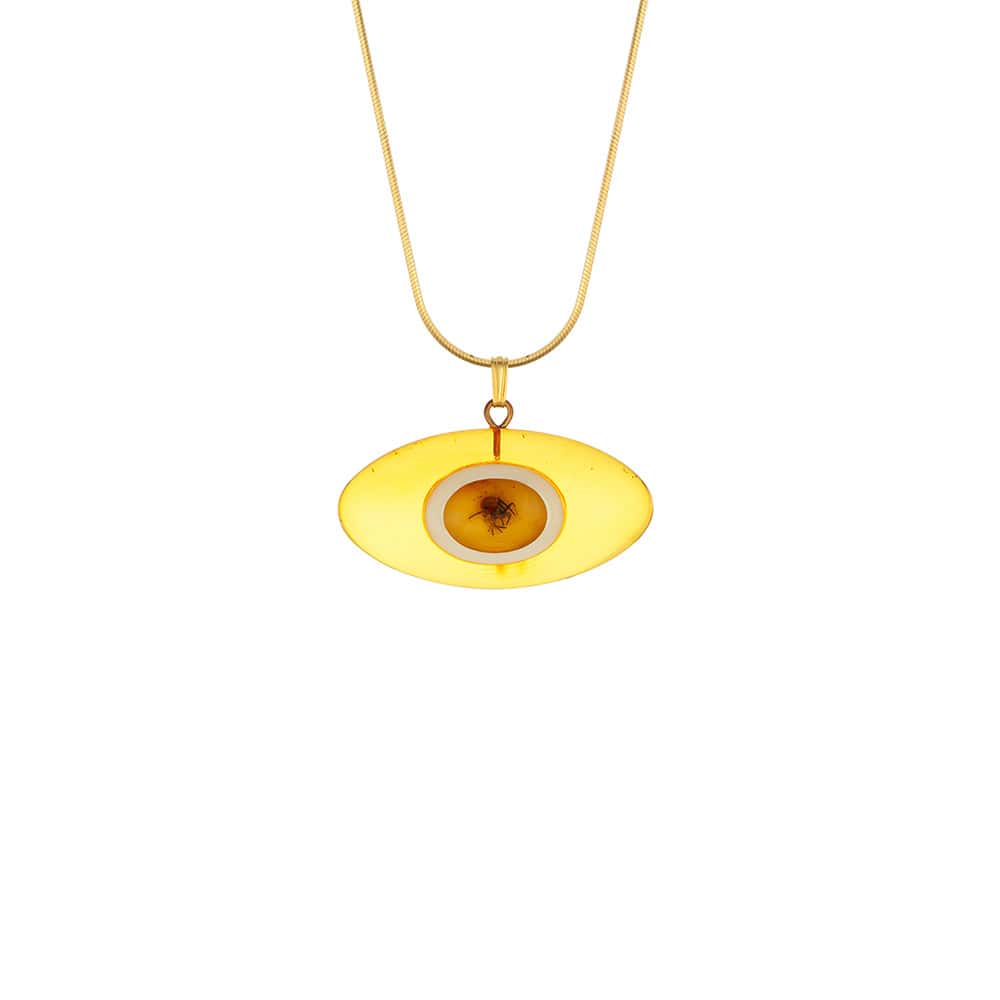 Yellow eye-shaped Baltic amber pendant on a elegant gold chain, handcrafted and unique.