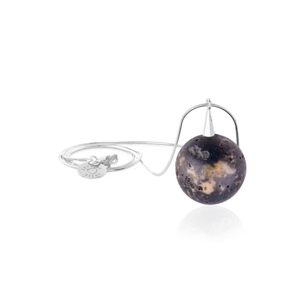 Celestial-inspired marbled sphere pendant with silver accents, perfect for elegant everyday or special wear.