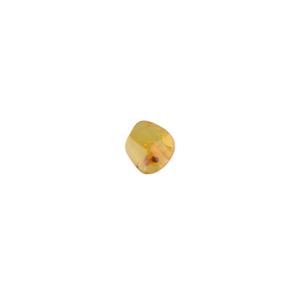 Polished golden gemstone, reflecting light, with smooth edges and vibrant yellow hue.