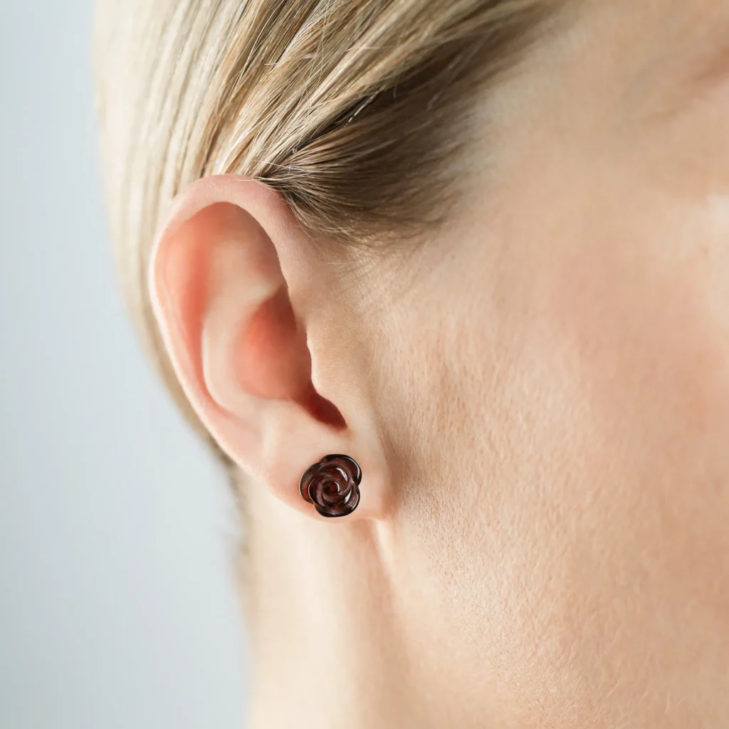 Elegant Baltic amber rose earring on gold stud, perfect for sophisticated and stylish looks.