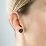 Elegant Baltic amber rose earring on gold stud, perfect for sophisticated and stylish looks.