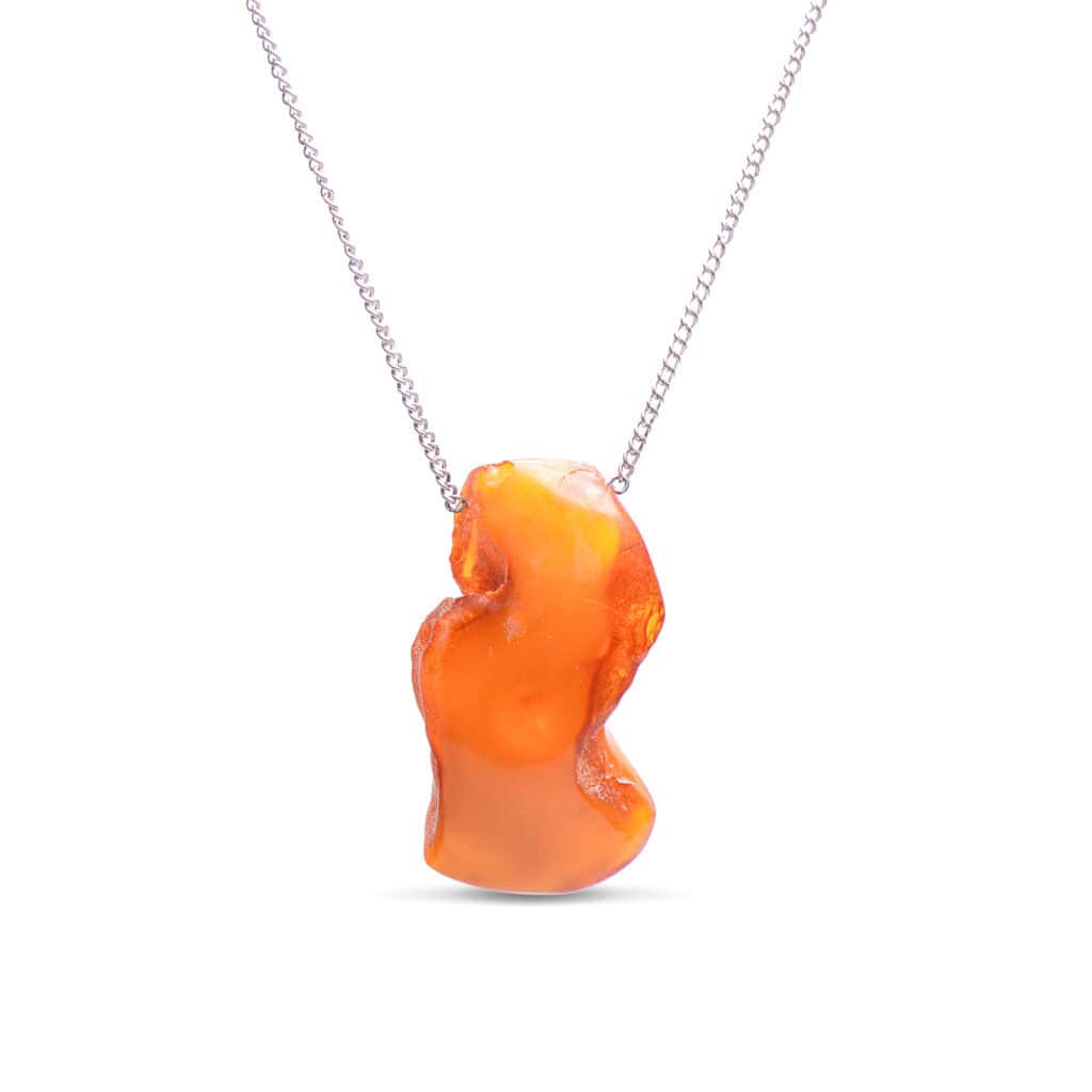 Elegant orange Baltic amber pendant on a sleek silver chain for timeless style.