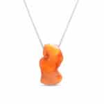 Elegant orange Baltic amber pendant on a sleek silver chain for timeless style.