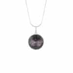 Earthy black volcanic pendant with sterling silver chain, versatile and handcrafted for everyday elegance.