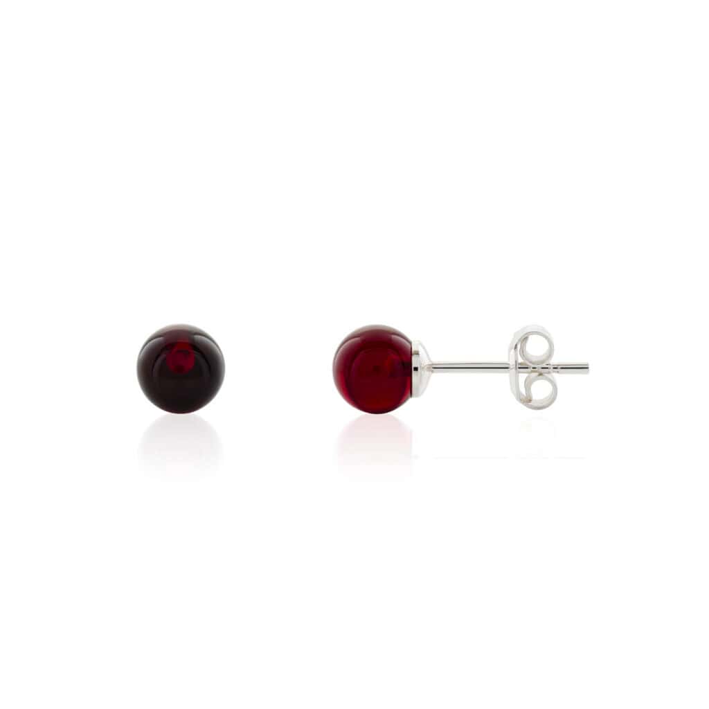 Elegant red Baltic amber stud earrings with silver posts for versatile, timeless style.