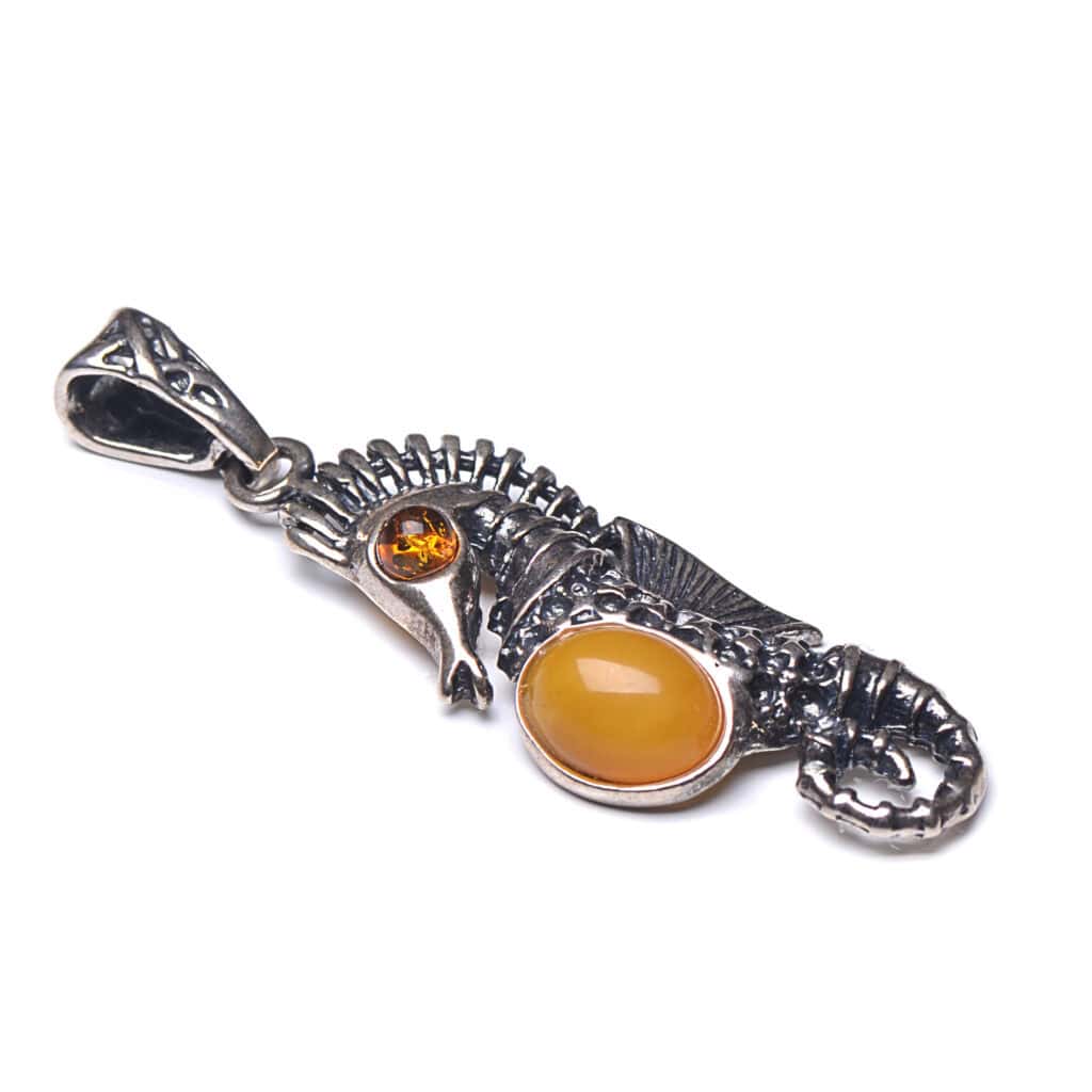 Elegant silver seahorse pendant with Baltic amber accents, handcrafted jewelry for nature lovers.