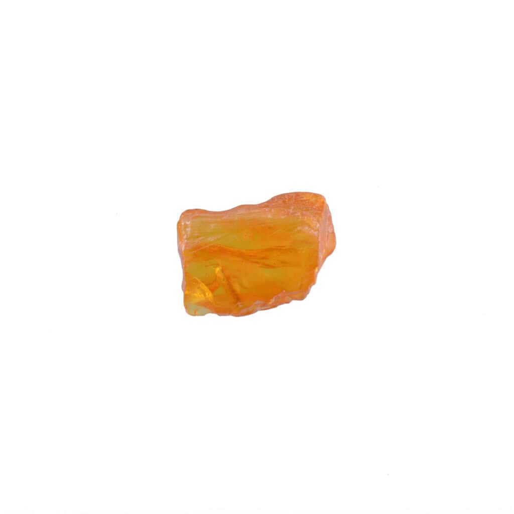 Polished natural orange Baltic amber with subtle patterns and organic, rounded shape, capturing earths natural beauty.
