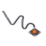 Vintage-style necklace with ornate pendant and vibrant orange center, dark metal chain, handcrafted elegance.