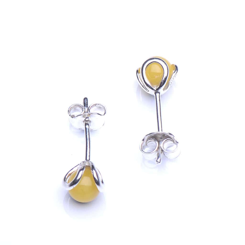 Elegant yellow gemstone stud earrings with silver settings for everyday or special occasions.