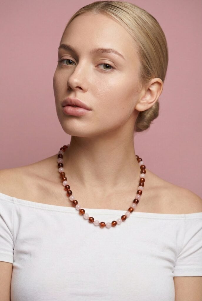 Blonde woman with cognac amber and rose quartz necklace