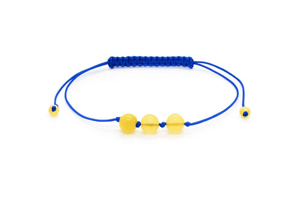 natural amber beads, three in the center with blue string