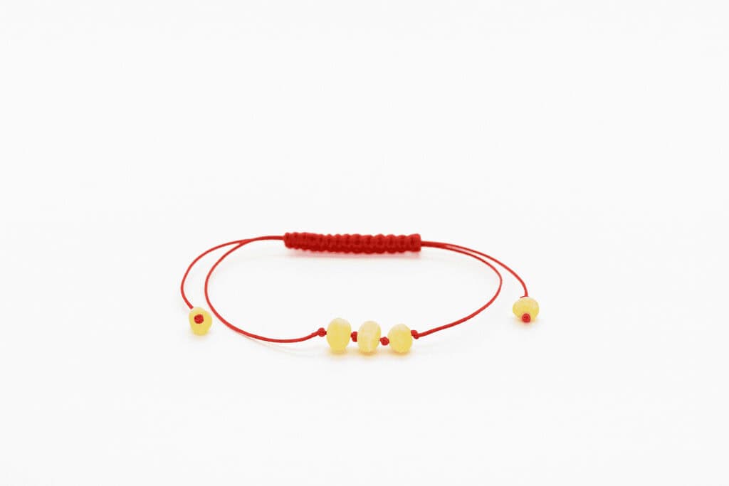 natural amber bracelet with three center beads, red string