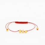natural amber bracelet with three center beads, red string